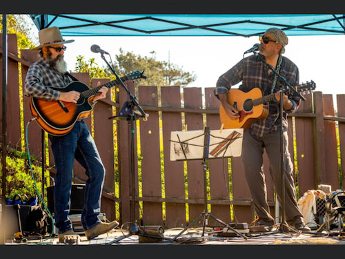 duo performing by highway
